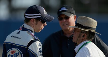 FONTANA, CA - MARCH 22: Brad Keselowski (L), driver of the #2 Miller Lite Ford, talks with team owner Jack Roush (R) on the grid during qualifying for the NASCAR Sprint Cup Series Auto Club 400 at Auto Club Speedway on March 22, 2013 in Fontana, California.  (Photo by Justin Edmonds/NASCAR via Getty Images)