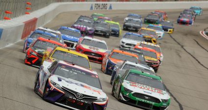 HAMPTON, GEORGIA - MARCH 21: Denny Hamlin, driver of the #11 FedEx Express Toyota, and Kevin Harvick, driver of the #4 Hunt Brothers Pizza Ford, lead the field during the NASCAR Cup Series Folds of Honor QuikTrip 500 at Atlanta Motor Speedway on March 21, 2021 in Hampton, Georgia. (Photo by Kevin C. Cox/Getty Images) | Getty Images