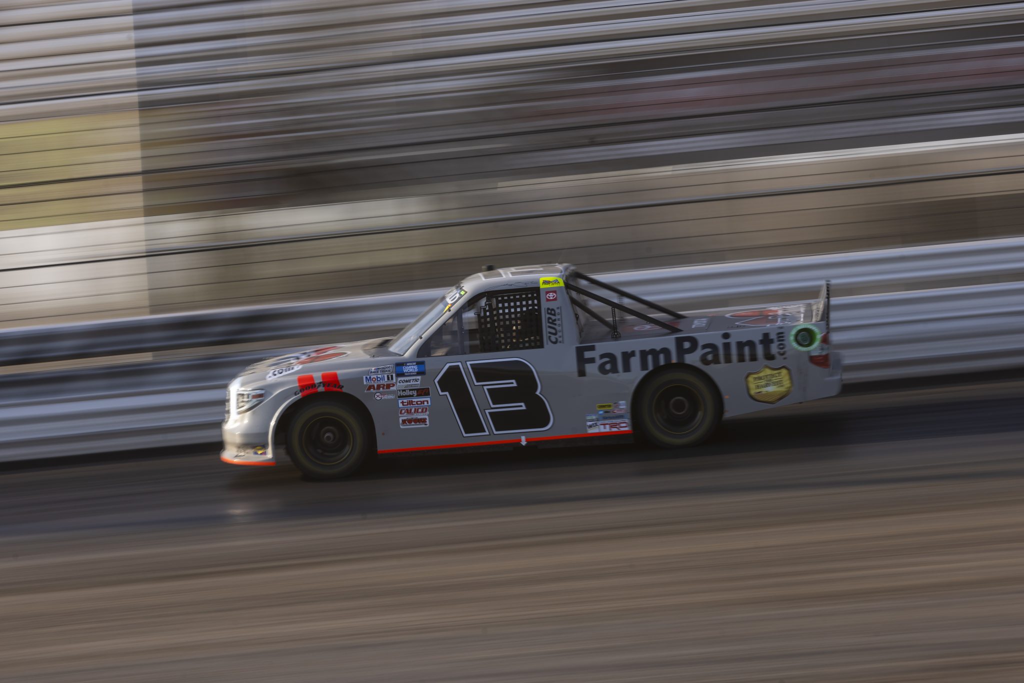KNOXVILLE, IOWA - JULY 08: Johnny Sauter, driver of the #13 FarmPaint.com Toyota, drives during practice for the NASCAR Camping World Truck Series Corn Belt 150 presented by Premier Chevy Dealers at Knoxville Raceway on July 08, 2021 in Knoxville, Iowa. (Photo by James Gilbert/Getty Images) | Getty Images