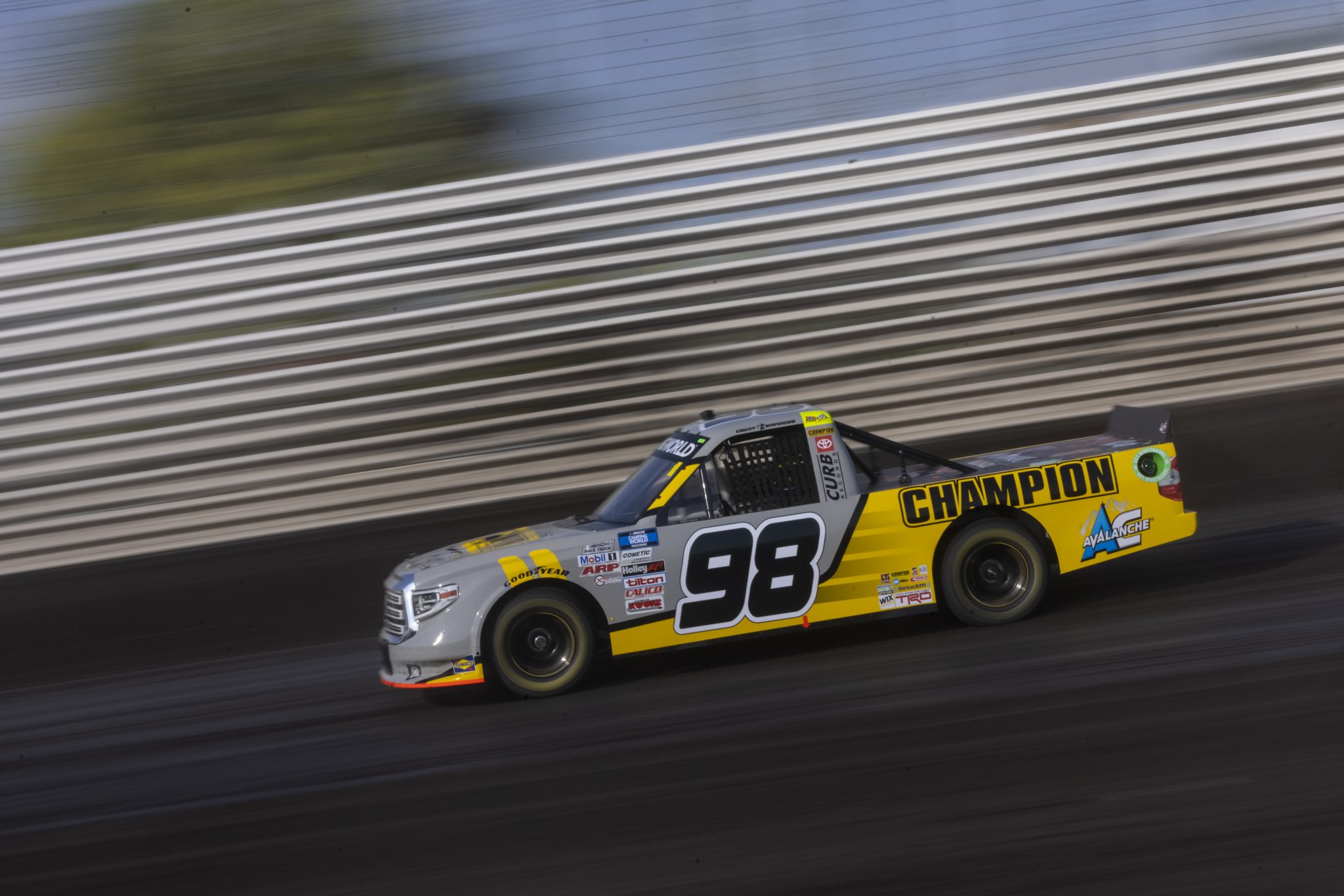 KNOXVILLE, IOWA - JULY 08: Grant Enfinger, driver of the #98 Champion/Curb Records Toyota, drives during practice for the NASCAR Camping World Truck Series Corn Belt 150 presented by Premier Chevy Dealers at Knoxville Raceway on July 08, 2021 in Knoxville, Iowa. (Photo by James Gilbert/Getty Images) | Getty Images