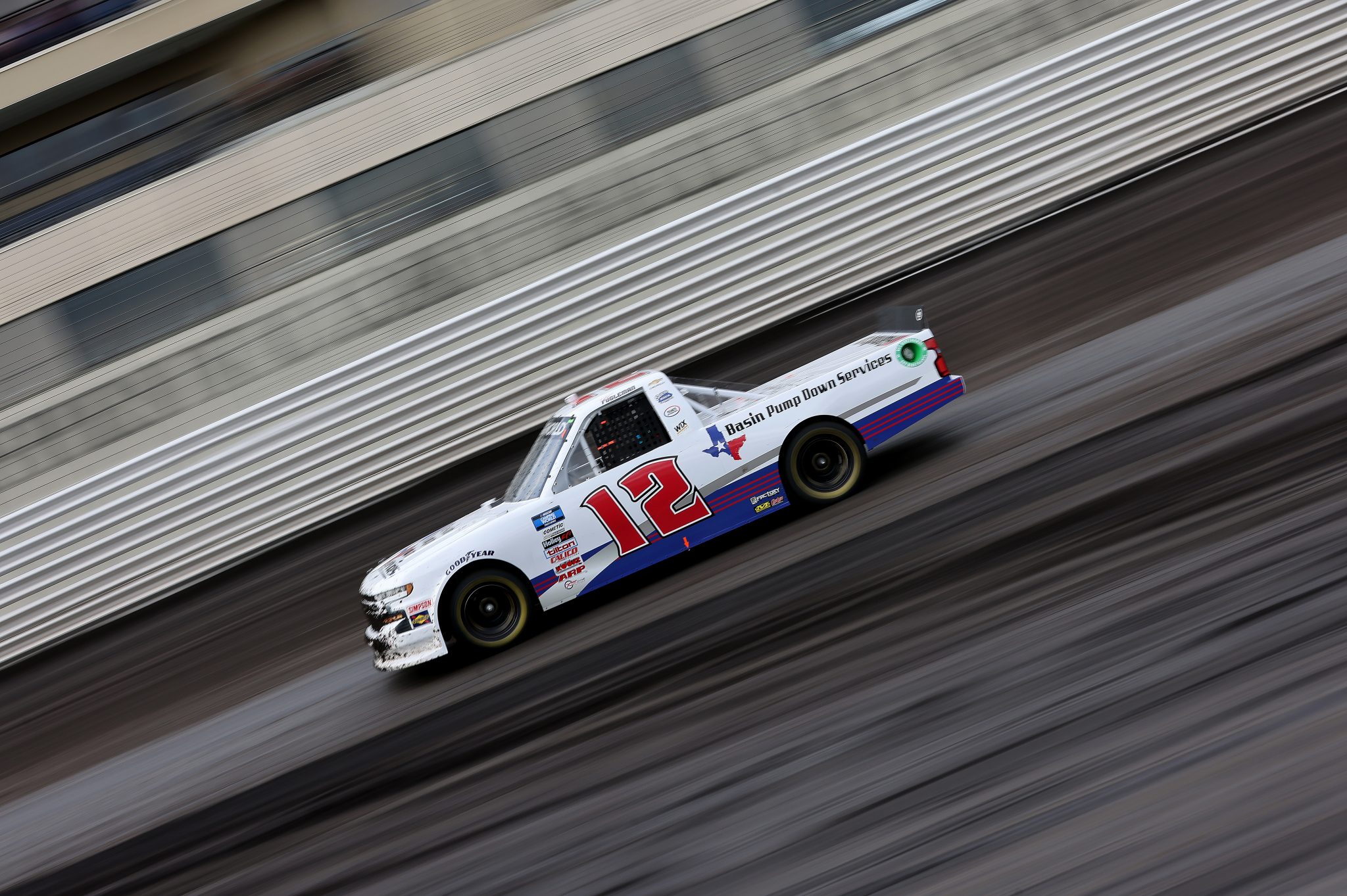 KNOXVILLE, IOWA - JULY 09: Tate Fogleman, driver of the #12 Basin Pump Down Services Chevrolet, drives during qualifying for the NASCAR Camping World Truck Series Corn Belt 150 presented by Premier Chevy Dealers at Knoxville Raceway on July 09, 2021 in Knoxville, Iowa. (Photo by James Gilbert/Getty Images) | Getty Images