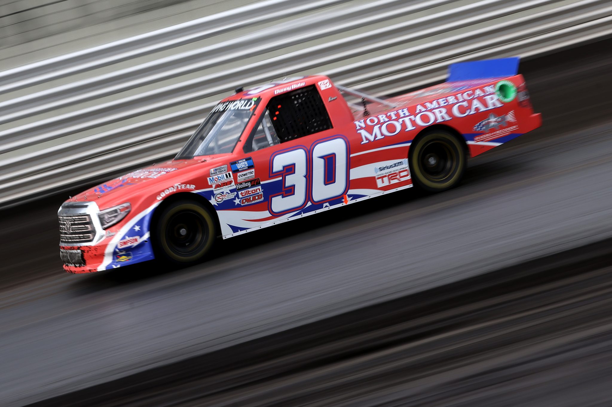 KNOXVILLE, IOWA - JULY 09: Danny Bohn, driver of the #30 North American Motor Car Toyota, drives during qualifying for the NASCAR Camping World Truck Series Corn Belt 150 presented by Premier Chevy Dealers at Knoxville Raceway on July 09, 2021 in Knoxville, Iowa. (Photo by James Gilbert/Getty Images) | Getty Images