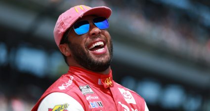 INDIANAPOLIS, INDIANA - AUGUST 15: Bubba Wallace, driver of the #23 McDonald's Toyota, laughs on the grid prior to the NASCAR Cup Series Verizon 200 at the Brickyard at Indianapolis Motor Speedway on August 15, 2021 in Indianapolis, Indiana. (Photo by Sean Gardner/Getty Images) | Getty Images