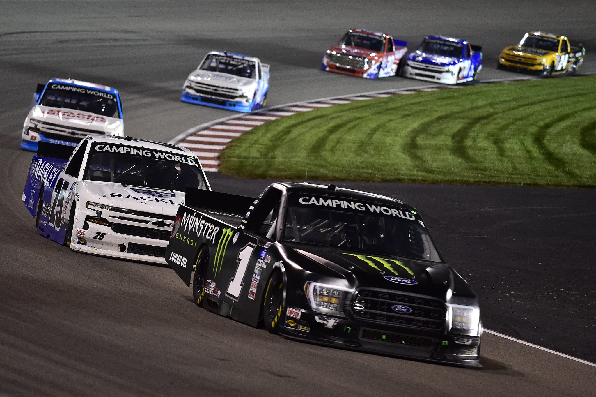 MADISON, ILLINOIS - AUGUST 20: Hailie Deegan, driver of the #1 Monster Ford, and Josh Berry, driver of the #25 Rackley Roofing Chevrolet, race during the NASCAR Camping World Truck Series Toyota 200 presented by CK Power at Gateway Motorsports Park on August 20, 2021 in Madison, Illinois. (Photo by Jeff Curry/Getty Images) | Getty Images