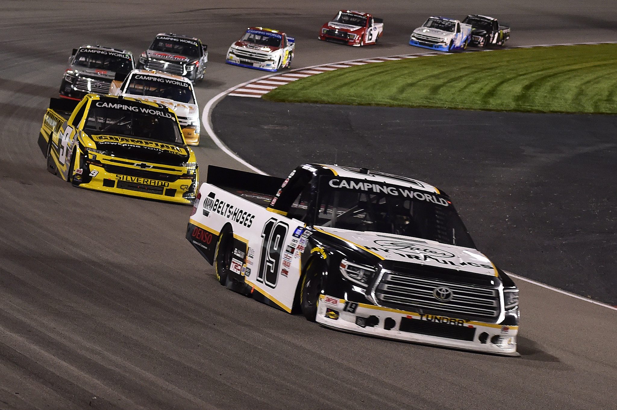 MADISON, ILLINOIS - AUGUST 20: Derek Kraus, driver of the #19 NAPA Belts & Hoses/Gates Hydraulics Toyota, and Grant Enfinger, driver of the #9 Champion Power Equipment Chevrolet, race during the NASCAR Camping World Truck Series Toyota 200 presented by CK Power at Gateway Motorsports Park on August 20, 2021 in Madison, Illinois. (Photo by Jeff Curry/Getty Images) | Getty Images