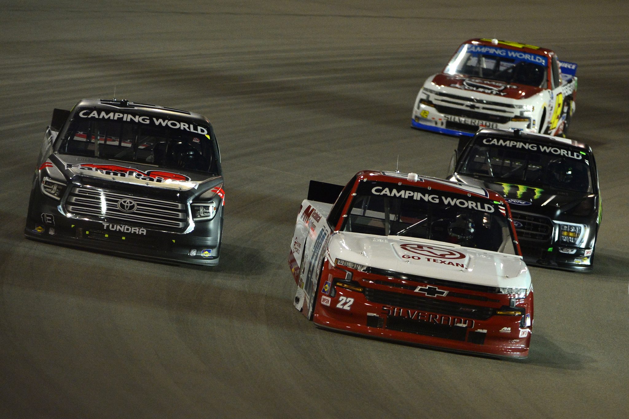 MADISON, ILLINOIS - AUGUST 20: Austin Wayne Self, driver of the #22 GOTEXAN/AM Technical Solutions Chevrolet, Johnny Sauter, driver of the #13 FarmPaint.com Toyota, and Hailie Deegan, driver of the #1 Monster Ford, race during the NASCAR Camping World Truck Series Toyota 200 presented by CK Power at Gateway Motorsports Park on August 20, 2021 in Madison, Illinois. (Photo by Jeff Curry/Getty Images) | Getty Images