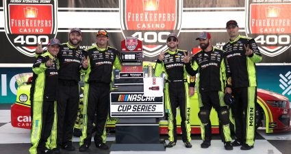 BROOKLYN, MICHIGAN - AUGUST 22: Ryan Blaney, driver of the #12 Menards/Cardell Cabinetry Ford, and crew celebrate in the Ruoff Mortgage victory lane after winning the NASCAR Cup Series FireKeepers Casino 400 at Michigan International Speedway on August 22, 2021 in Brooklyn, Michigan. (Photo by Sean Gardner/Getty Images) | Getty Images