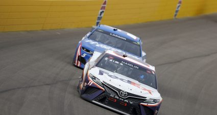 LAS VEGAS, NEVADA - MARCH 07: Denny Hamlin, driver of the #11 FedEx Ground Toyota, leads Kyle Larson, driver of the #5 HendrickCars.com Chevrolet, during the NASCAR Cup Series Pennzoil 400 presented by Jiffy Lube at the Las Vegas Motor Speedway on March 07, 2021 in Las Vegas, Nevada. (Photo by Brian Lawdermilk/Getty Images) | Getty Images