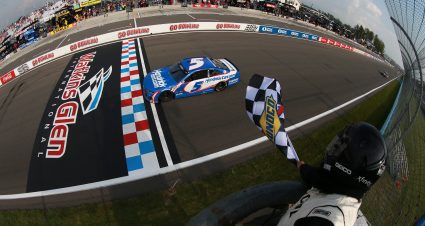 WATKINS GLEN, NEW YORK - AUGUST 08: Kyle Larson, driver of the #5 HendrickCars.com Chevrolet, takes the checkered flag to win the NASCAR Cup Series Go Bowling at The Glen at Watkins Glen International on August 08, 2021 in Watkins Glen, New York. (Photo by Sean Gardner/Getty Images) | Getty Images