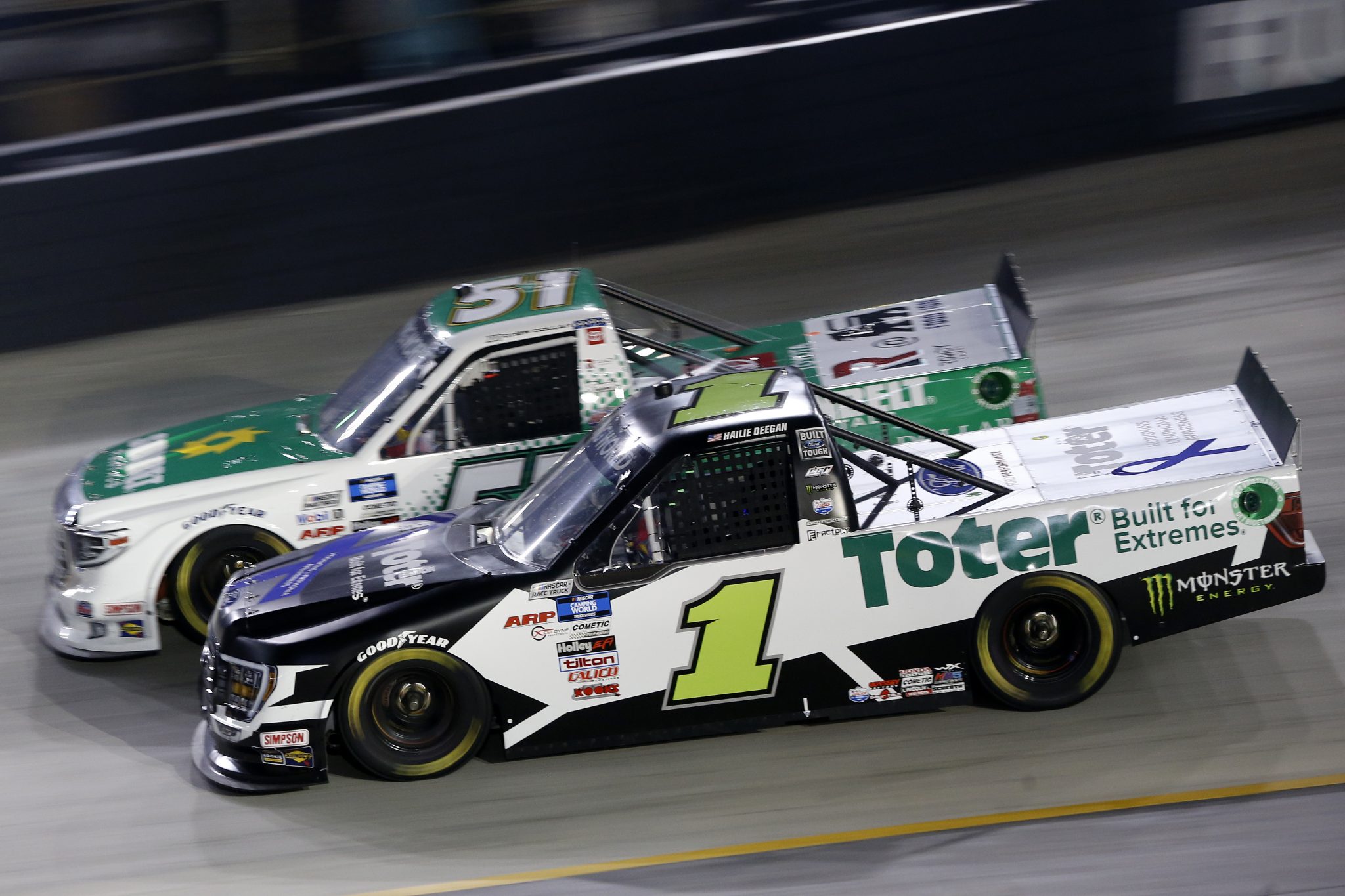 BRISTOL, TENNESSEE - SEPTEMBER 16: Hailie Deegan, driver of the #1 Toter/Engine Ice Ford, and Drew Dollar, driver of the #51 Sunbelt Rentals Toyota, race during the NASCAR Camping World Truck Series UNOH 200 presented by Ohio Logistics at Bristol Motor Speedway on September 16, 2021 in Bristol, Tennessee. (Photo by Brian Lawdermilk/Getty Images) | Getty Images