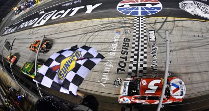 BRISTOL, TENNESSEE - SEPTEMBER 18: Kyle Larson, driver of the #5 Valvoline Chevrolet, takes the checkered flag to win the NASCAR Cup Series Bass Pro Shops Night Race at Bristol Motor Speedway on September 18, 2021 in Bristol, Tennessee. (Photo by Logan Riely/Getty Images) | Getty Images