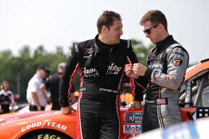 ELKHART LAKE, WISCONSIN - JULY 03: Stephen Leicht, driver of the #13 Janiking Toyota, and Matt Jaskol, driver of the #66 Auto Parts 4 Less Toyota, talk on the grid during the NASCAR Xfinity Series Henry 180 at Road America on July 03, 2021 in Elkhart Lake, Wisconsin. (Photo by James Gilbert/Getty Images) | Getty Images