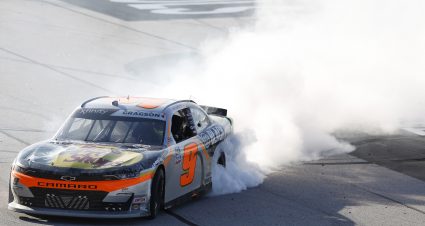 DARLINGTON, SOUTH CAROLINA - SEPTEMBER 04: Noah Gragson, driver of the #9 Bass Pro Shops/TrueTimber/BRCC Chevrolet, celebrates with a burnout after winning the NASCAR Xfinity Series Sport Clips Haircuts VFW Help A Hero 200 at Darlington Raceway on September 04, 2021 in Darlington, South Carolina. (Photo by Jared East/Getty Images) | Getty Images