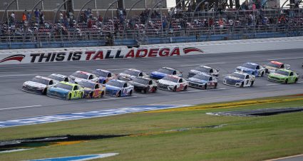 TALLADEGA, ALABAMA - OCTOBER 04: Denny Hamlin, driver of the #11 FedEx Express Toyota, and Matt DiBenedetto, driver of the #21 Menards/Tuscany Ford, lead the field during the NASCAR Cup Series YellaWood 500 at Talladega Superspeedway on October 04, 2020 in Talladega, Alabama. (Photo by Chris Graythen/Getty Images) | Getty Images