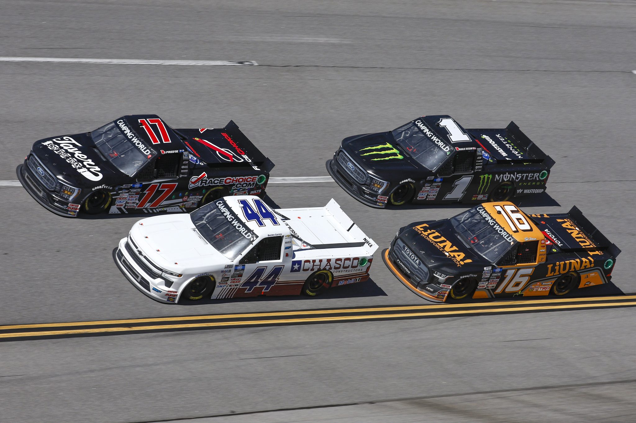 TALLADEGA, ALABAMA - OCTOBER 01: Ryan Preece, driver of the #17 RaceChoice/Tavern on the Trax Ford, Bayley Currey, driver of the #44 Chasco Contractors Chevrolet, Tyler Ankrum, driver of the #16 LiUNA! Toyota, and Hailie Deegan, driver of the #1 Monster Energy Ford, race during the NASCAR Camping World Truck Series Chevy Silverado 250 at Talladega Superspeedway on October 01, 2022 in Talladega, Alabama. (Photo by Sean Gardner/Getty Images) | Getty Images