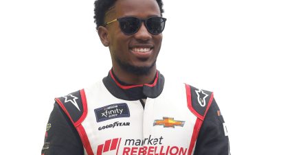 KANSAS CITY, KANSAS - SEPTEMBER 10: Rajah Caruth, driver of the #45 iRacing Chevrolet, walks onstage during driver intros prior to the NASCAR Xfinity Series Kansas Lottery 300 at Kansas Speedway on September 10, 2022 in Kansas City, Kansas. (Photo by Chris Graythen/Getty Images) | Getty Images