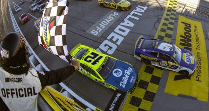 TALLADEGA, ALABAMA - OCTOBER 02: Chase Elliott, driver of the #9 NAPA Auto Parts Chevrolet, takes the checkered flag to win the NASCAR Cup Series YellaWood 500 at Talladega Superspeedway on October 02, 2022 in Talladega, Alabama. (Photo by Sean Gardner/Getty Images) | Getty Images