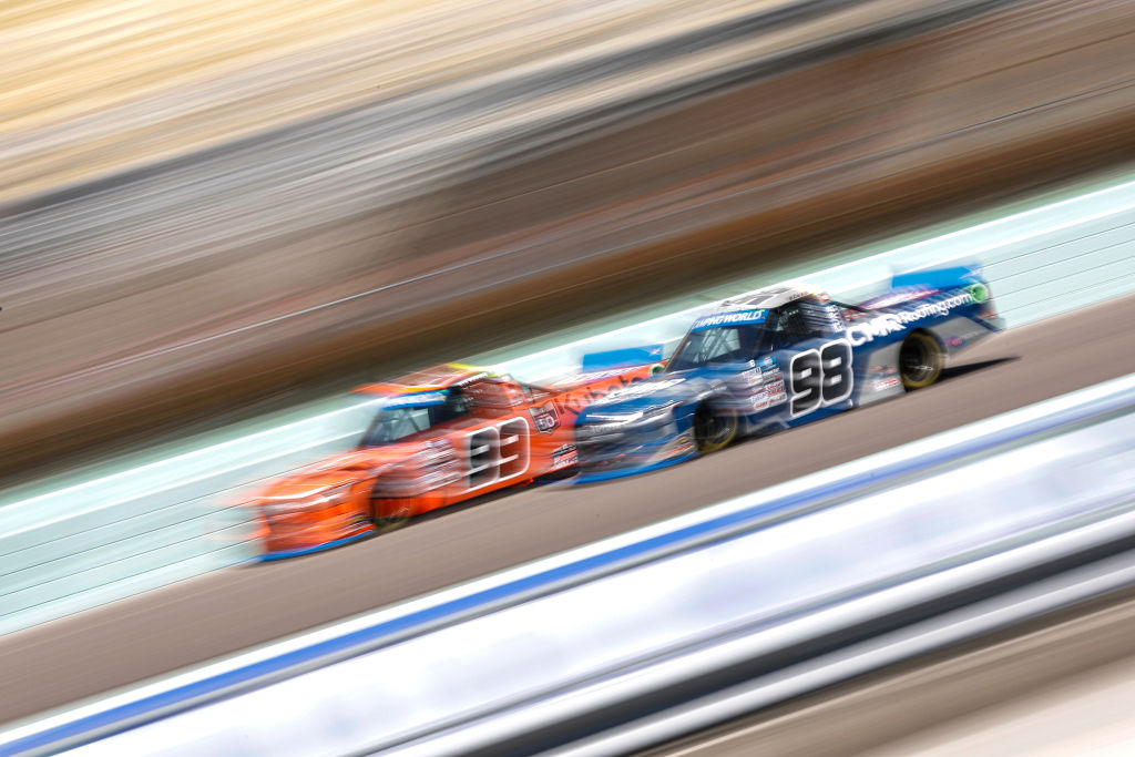 HOMESTEAD, FLORIDA - OCTOBER 22: Ben Rhodes, driver of the #99 Kubota Toyota, and Christian Eckes, driver of the #98 CMR Construction & Roofing Toyota, race during the NASCAR Camping World Truck Series Baptist Health 200 at Homestead-Miami Speedway on October 22, 2022 in Homestead, Florida. (Photo by Sean Gardner/Getty Images) | Getty Images