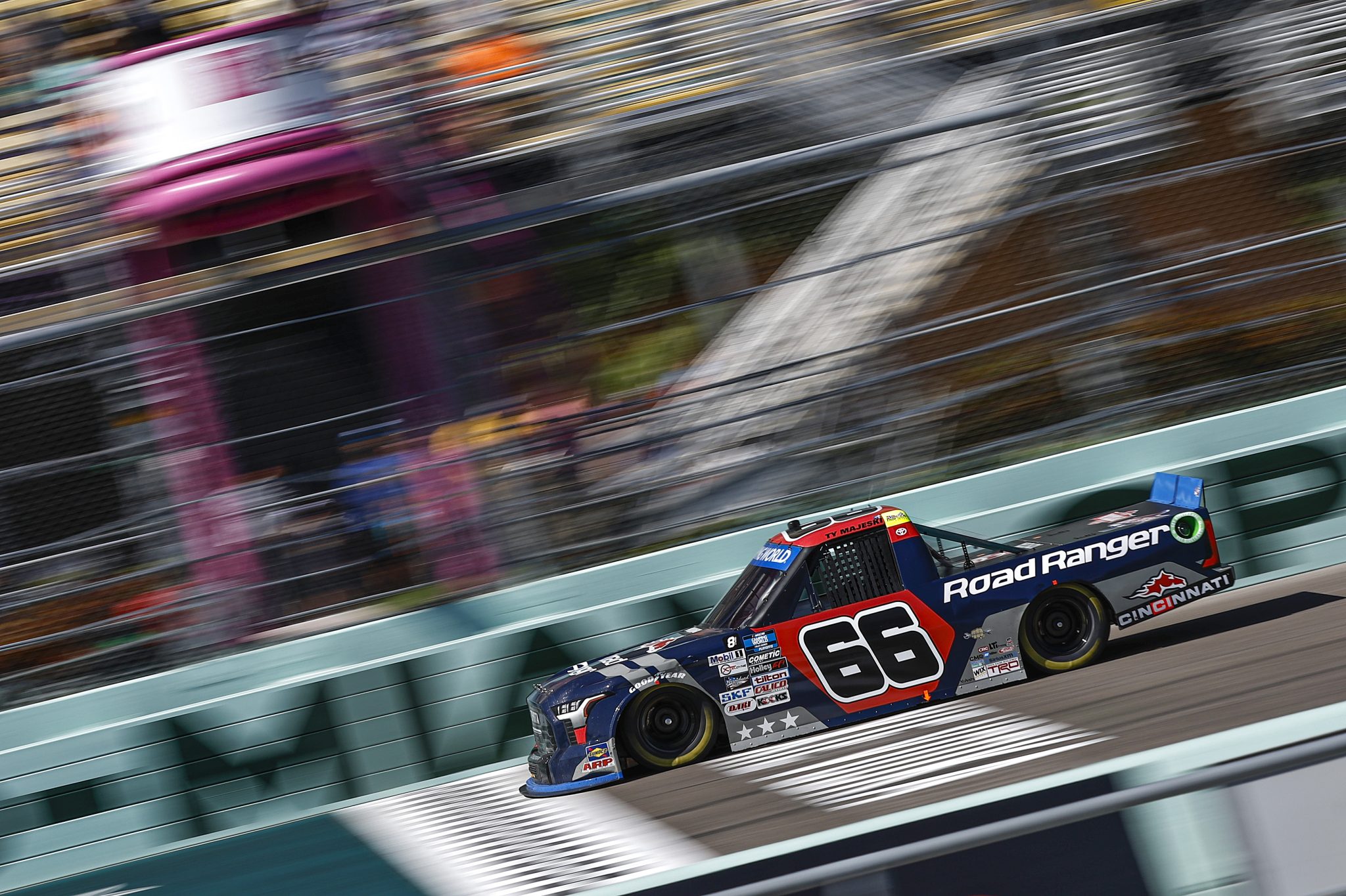 HOMESTEAD, FLORIDA - OCTOBER 22: Ty Majeski, driver of the #66 Road Ranger Toyota, crosses the finish line to win the NASCAR Camping World Truck Series Baptist Health 200 at Homestead-Miami Speedway on October 22, 2022 in Homestead, Florida. (Photo by Sean Gardner/Getty Images) | Getty Images