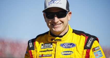 TALLADEGA, ALABAMA - OCTOBER 01: Michael McDowell, driver of the #34 Love's Travel Stops Ford, walks the grid during qualifying for the NASCAR Cup Series YellaWood 500 at Talladega Superspeedway on October 01, 2022 in Talladega, Alabama. (Photo by Sean Gardner/Getty Images) | Getty Images