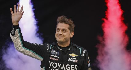 BRISTOL, TENNESSEE - SEPTEMBER 16: Landon Cassill, driver of the #10 Voyager: Crypto for All Chevrolet, waves to fans as he walks onstage during driver intros prior to the NASCAR Xfinity Series Food City 300 at Bristol Motor Speedway on September 16, 2022 in Bristol, Tennessee. (Photo by Sean Gardner/Getty Images) | Getty Images