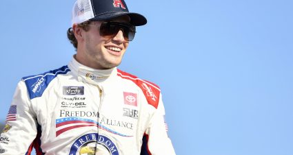 LONG POND, PENNSYLVANIA - JULY 23: Santino Ferrucci, driver of the #26 Freedom Alliance Toyota, walks onstage during driver intros prior to the NASCAR Xfinity Series Explore the Pocono Mountains 225 at Pocono Raceway on July 23, 2022 in Long Pond, Pennsylvania. (Photo by Logan Riely/Getty Images) | Getty Images