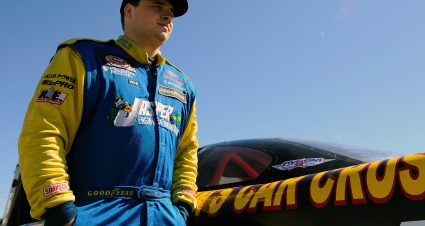 DAYTONA BEACH, FL - FEBRUARY 18:  Coleman Pressley, driver of the #59 NASCAR Whelen All-American Series, stands by his car in the garage area during the UNOH Battle At The Beach at Daytona International Speedway on February 18, 2013 in Daytona Beach, Florida.  (Photo by Jared C. Tilton/NASCAR via Getty Images)