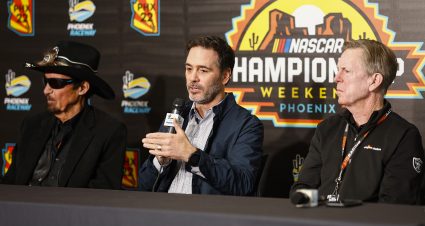 AVONDALE, ARIZONA - NOVEMBER 04:  Former NASCAR driver, Jimmie Johnson (C) speaks to the media announcing he has invested in an ownership stake in the Petty GMS Motorsports as team owners Richard Petty (L) and Maury Gallagher (R) look on during a press conference at Phoenix Raceway on November 04, 2022 in Avondale, Arizona. (Photo by Chris Graythen/Getty Images) | Getty Images