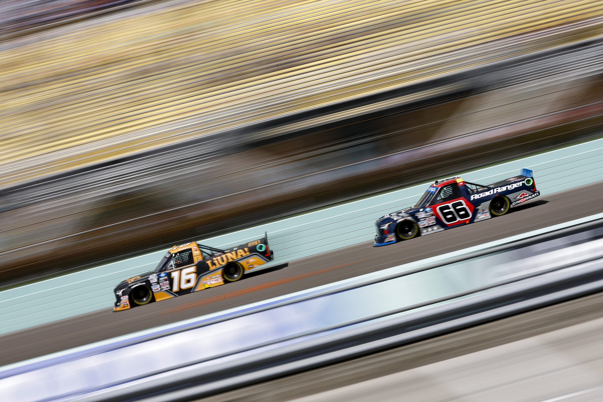 HOMESTEAD, FLORIDA - OCTOBER 22: Tyler Ankrum, driver of the #16 LiUNA! Toyota, and Ty Majeski, driver of the #66 Road Ranger Toyota, race during the NASCAR Camping World Truck Series Baptist Health 200 at Homestead-Miami Speedway on October 22, 2022 in Homestead, Florida. (Photo by Sean Gardner/Getty Images) | Getty Images