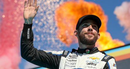 AVONDALE, ARIZONA - NOVEMBER 06: Ross Chastain, driver of the #1 Worldwide Express/Advent Health Chevrolet, waves to fans onstage during the Championship 4 driver intros prior to the NASCAR Cup Series Championship at Phoenix Raceway on November 06, 2022 in Avondale, Arizona. (Photo by Meg Oliphant/Getty Images) | Getty Images