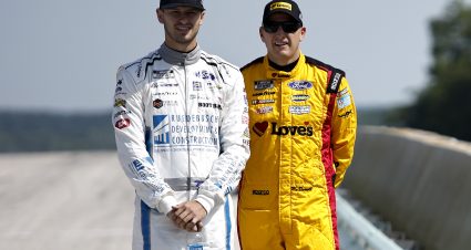 ELKHART LAKE, WISCONSIN - JULY 02: Todd Gilliland, driver of the #38 Ruedebusch Dev. & Construction Ford, (L). and Michael McDowell, driver of the #34 Love's Travel Stops Ford, wait on the grid during practice for the NASCAR Cup Series Kwik Trip 250 at Road America on July 02, 2022 in Elkhart Lake, Wisconsin. (Photo by Sean Gardner/Getty Images) | Getty Images