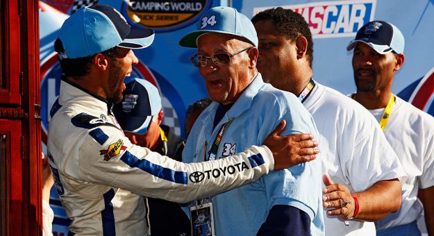 MARTINSVILLE, VA - OCTOBER 25:  Darrell Wallace, Jr., driver of the #34 2015 NASCAR Hall of Fame Inductee Wendell Scott Toyota, celebrates with Wendell Scott, Jr. in Victory Lane after Wallce Jr's victory in the NASCAR Camping World Truck Series Kroger 200 at Martinsville Speedway on October 25, 2014 in Martinsville, Virginia.  (Photo by Brian Lawdermilk/Getty Images) | Getty Images