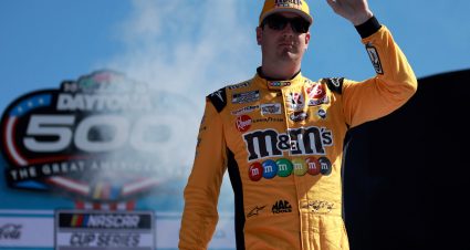 DAYTONA BEACH, FLORIDA - FEBRUARY 20: Kyle Busch, driver of the #18 M&M's Toyota, waves to fans onstage during the driver intros prior to the NASCAR Cup Series 64th Annual Daytona 500 at Daytona International Speedway on February 20, 2022 in Daytona Beach, Florida. (Photo by Jared C. Tilton/Getty Images) | Getty Images