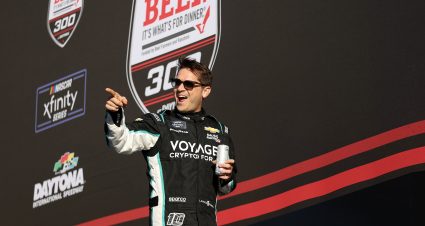 DAYTONA BEACH, FLORIDA - FEBRUARY 19: Landon Cassill, driver of the #10 Voyager: Crypto for All Chevrolet, waves to fans onstage during the driver intros prior to the NASCAR Xfinity Series Beef. It's What's For Dinner. 300 at Daytona International Speedway on February 19, 2022 in Daytona Beach, Florida. (Photo by James Gilbert/Getty Images) | Getty Images