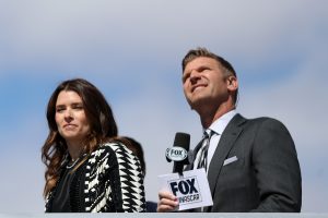 LAS VEGAS, NEVADA - MARCH 06: Former NASCAR drivers and members of the NASCAR on Fox broadcast team, Danica Patrick and Clint Bowyer look on during pre-race ceremonies prior to the NASCAR Cup Series Pennzoil 400 at Las Vegas Motor Speedway on March 06, 2022 in Las Vegas, Nevada. (Photo by Meg Oliphant/Getty Images) | Getty Images