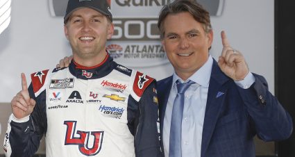 HAMPTON, GEORGIA - MARCH 20: William Byron, driver of the #24 Liberty University Chevrolet, and Jeff Gordon, Vice Chairman of Hendrick Motorsports celebrate in victory lane after winning the NASCAR Cup Series Folds of Honor QuikTrip 500 at Atlanta Motor Speedway on March 20, 2022 in Hampton, Georgia. (Photo by Sean Gardner/Getty Images) | Getty Images