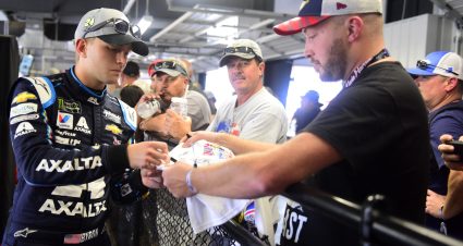TALLADEGA, ALABAMA - OCTOBER 11: William Byron, driver of the #24 Axalta Chevrolet, signs autographs for fans during practice for the Monster Energy NASCAR Cup Series 1000Bulbs.com 500 at Talladega Superspeedway on October 11, 2019 in Talladega, Alabama. (Photo by Jared C. Tilton/Getty Images) | Getty Images