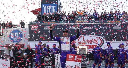 RICHMOND, VIRGINIA - APRIL 03: Denny Hamlin, driver of the #11 FedEx Express Toyota, celebrates in the Ruoff Mortgage victory lane after winning the NASCAR Cup Series Toyota Owners 400 at Richmond Raceway on April 03, 2022 in Richmond, Virginia. (Photo by Jacob Kupferman/Getty Images) | Getty Images