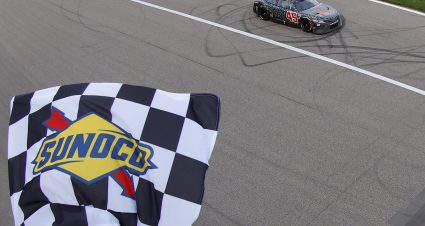 KANSAS CITY, KANSAS - MAY 15: Kurt Busch, driver of the #45 Jordan Brand Toyota, takes the checkered flag to win the NASCAR Cup Series AdventHealth 400 at Kansas Speedway on May 15, 2022 in Kansas City, Kansas. (Photo by Sean Gardner/Getty Images) | Getty Images