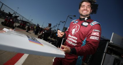 KANSAS CITY, KANSAS - MAY 14: Jesse Little, driver of the #02 RANDCO Industries Chevrolet, poses for a photo on the grid during practice for the NASCAR Camping World Truck Series Heart of America 200 at Kansas Speedway on May 14, 2022 in Kansas City, Kansas. (Photo by Sean Gardner/Getty Images) | Getty Images
