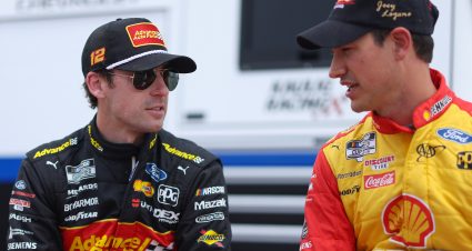 DARLINGTON, SOUTH CAROLINA - MAY 07: Ryan Blaney, driver of the #12 Advance Auto Parts Ford, (L) and Joey Logano, driver of the #22 Shell Pennzoil Ford, talk on the grid during qualifying for the NASCAR Cup Series Goodyear 400 at Darlington Raceway on May 07, 2022 in Darlington, South Carolina. (Photo by James Gilbert/Getty Images) | Getty Images