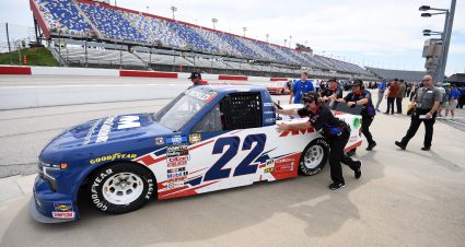 DARLINGTON, SOUTH CAROLINA - MAY 06: Crew members push the #22 AM Technical Solutions Chevrolet, driven by Austin Wayne Self on the grid during qualifying for the NASCAR Camping World Truck Series Dead on Tools 200 at Darlington Raceway on May 06, 2022 in Darlington, South Carolina. (Photo by Emilee Chinn/Getty Images) | Getty Images