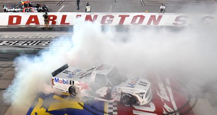 DARLINGTON, SOUTH CAROLINA - MAY 06: John Hunter Nemechek, driver of the #4 Mobil 1 Toyota, celebrates with a burnout after winning the NASCAR Camping World Truck Series Dead on Tools 200 at Darlington Raceway on May 06, 2022 in Darlington, South Carolina. (Photo by Emilee Chinn/Getty Images) | Getty Images