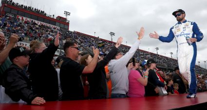 DARLINGTON, SOUTH CAROLINA - MAY 08: Ricky Stenhouse Jr., driver of the #47 Kroger/Nature Valley Chevrolet, high fives fans as he walks onstage during driver intros prior to the NASCAR Cup Series Goodyear 400 at Darlington Raceway on May 08, 2022 in Darlington, South Carolina. (Photo by James Gilbert/Getty Images) | Getty Images