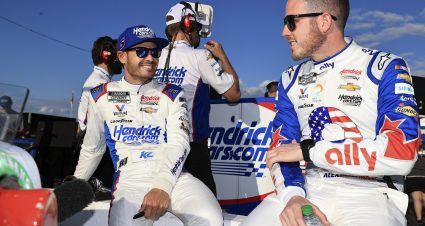 CONCORD, NORTH CAROLINA - MAY 28: Kyle Larson, driver of the #5 HendrickCars.com Chevrolet (L) and Alex Bowman, driver of the #48 Ally Patriotic Chevrolet,  talk on the grid during practice for the NASCAR Cup Series Coca-Cola 600 at Charlotte Motor Speedway on May 28, 2022 in Concord, North Carolina. (Photo by Buda Mendes/Getty Images) | Getty Images