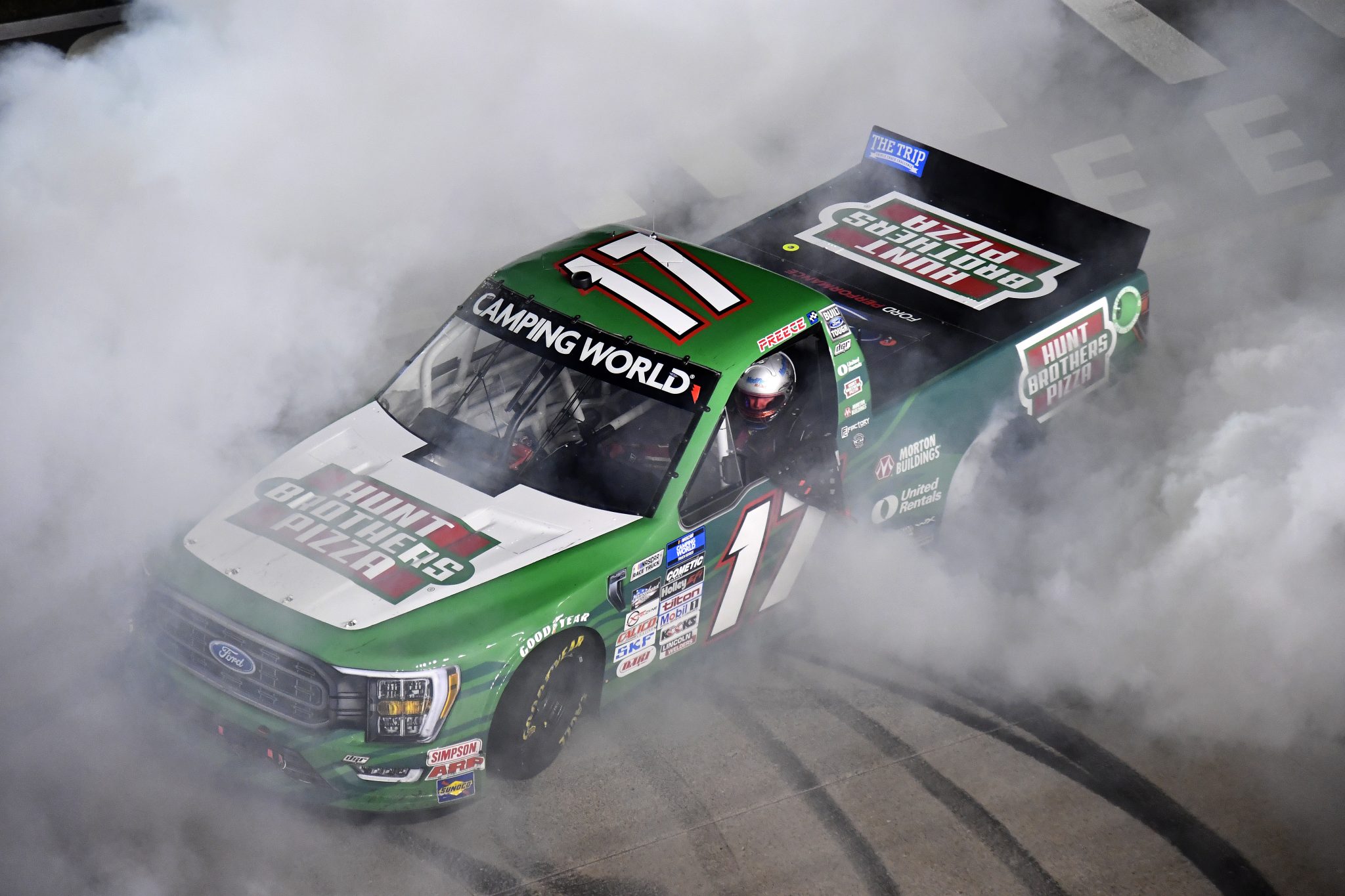 LEBANON, TENNESSEE - JUNE 24: Ryan Preece, driver of the #17 Hunt Brothers Pizza Ford, celebrates with a burnout after winning the NASCAR Camping World Truck Series Rackley Roofing 200 at Nashville Superspeedway on June 24, 2022 in Lebanon, Tennessee. (Photo by Logan Riely/Getty Images) | Getty Images