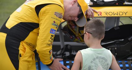 LEBANON, TENNESSEE - JUNE 19: Kyle Busch, driver of the #54 M&M's Toyota, and son Brexton talk on the grid prior to the NASCAR Xfinity Series Tennessee Lottery 250 at Nashville Superspeedway on June 19, 2021 in Lebanon, Tennessee. (Photo by Logan Riely/Getty Images) | Getty Images