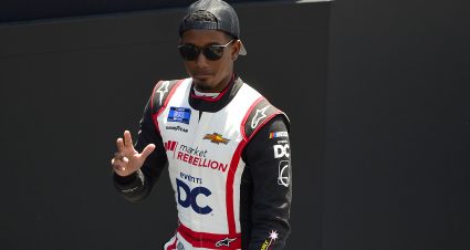 MADISON, ILLINOIS - JUNE 04: Rajah Caruth, driver of the #7 Confluence Music Festival Chevrolet, waves to fans onstage during driver intros prior to the NASCAR Camping World Truck Series Toyota 200 at WWT Raceway on June 04, 2022 in Madison, Illinois. (Photo by Jeff Curry/Getty Images) | Getty Images