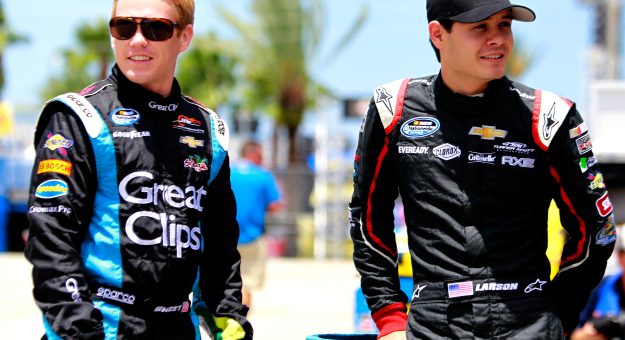 DAYTONA BEACH, FL - JULY 04:  (L-R) Brad Sweet, driver of the #5 Great Clips Chevrolet, talks with Kyle Larson, driver of the #32 Clorox Chevrolet, during practice for the NASCAR Nationwide Series Subway Firecracker 250 at Daytona International Speedway on July 4, 2013 in Daytona Beach, Florida.  (Photo by Sean Gardner/Getty Images) | Getty Images