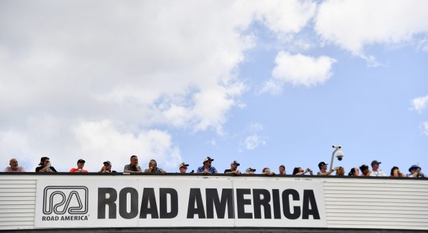 ELKHART LAKE, WISCONSIN - JULY 03: NASCAR fans looks on during pre-race ceremonies prior to the NASCAR Cup Series Kwik Trip 250 at Road America on July 03, 2022 in Elkhart Lake, Wisconsin. (Photo by Logan Riely/Getty Images) | Getty Images